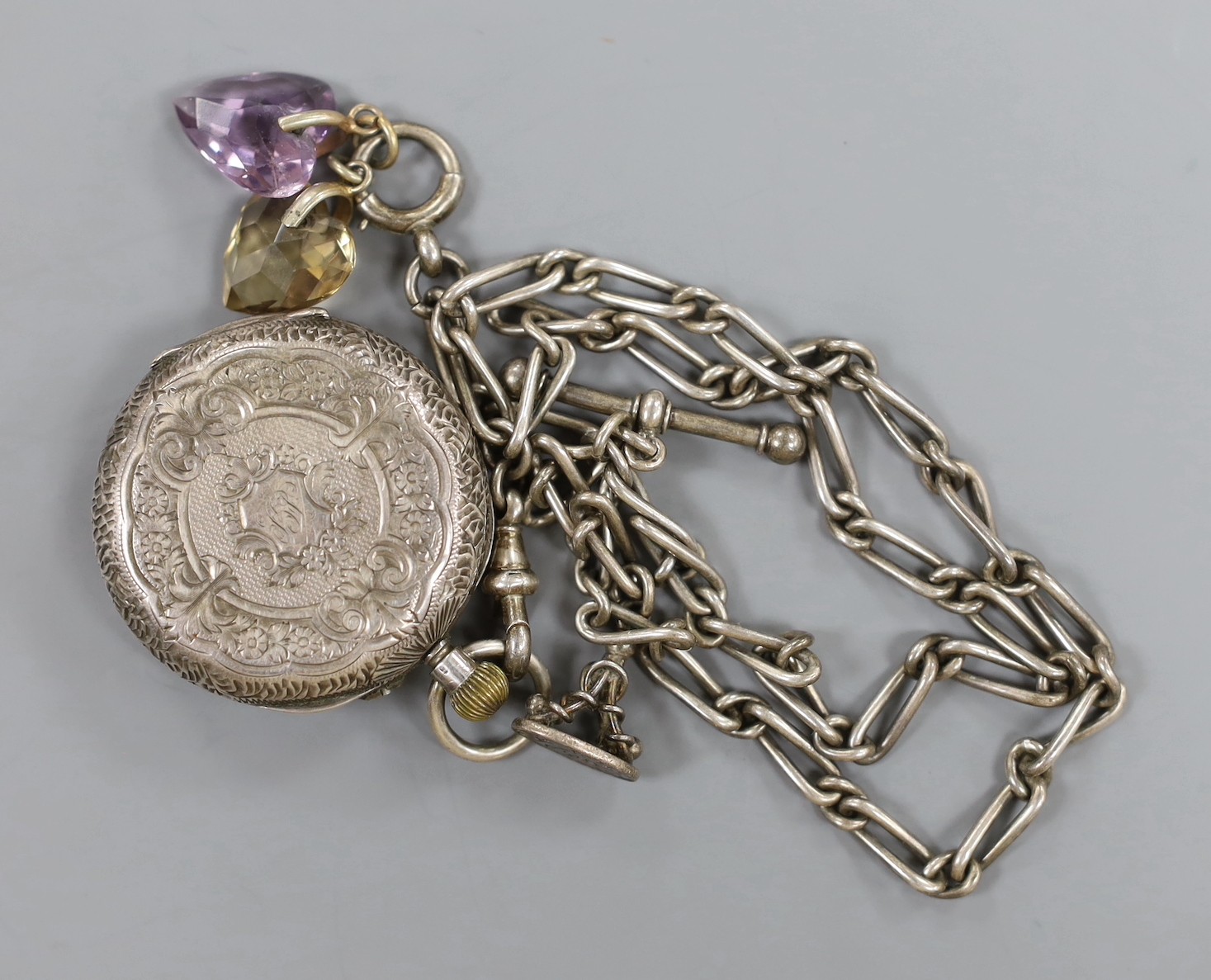 A lady's 9ct gold Omega manual wind wrist watch, a 935 white metal fob watch with albert and a silver open faced pocket watch.